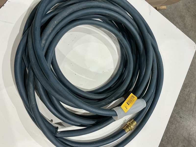 Condition photo showing As Is for 5/8 in. dia x 100 ft. standard duty green garden hose