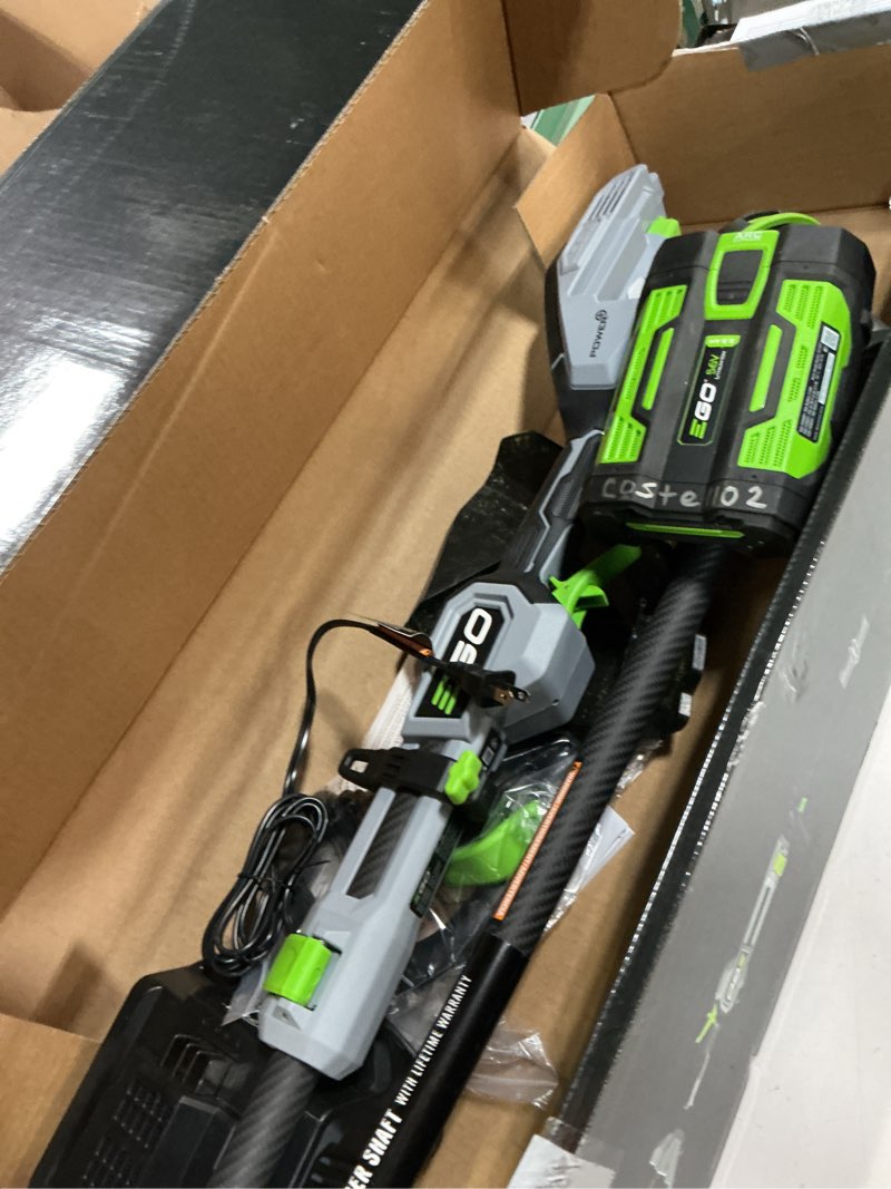 Condition photo showing As Is for ego battery string trimmer kit (battery & charger)