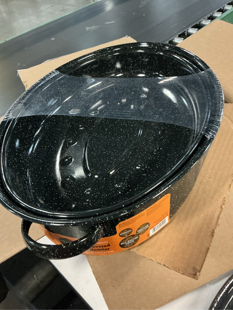 Condition photo showing New/Like New for granite ware 18  covered oval roaster  15 pound capacity  roasting pan