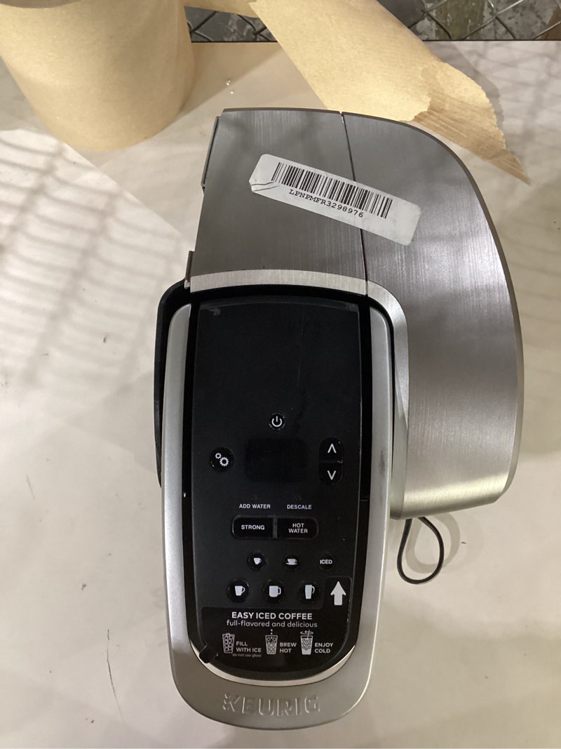 Condition photo showing As Is for keurig k-elite single serve k-cup pod coffee maker, with strength and temperature control, iced coffee capability, 8 to 12oz brew size, programmable, brushed silver