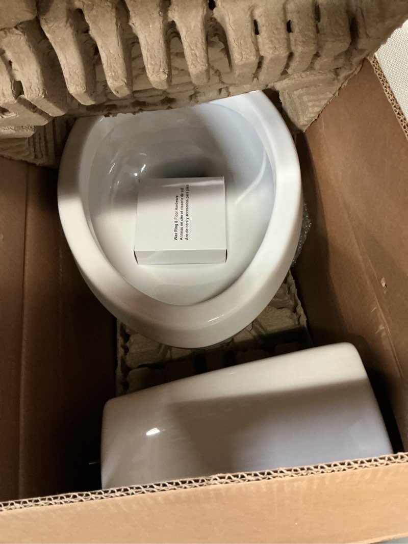 Condition photo showing As Is for project source pro-flush white elongated chair height 12-in rough-in watersense 1.28 gpf 2-piece toilet