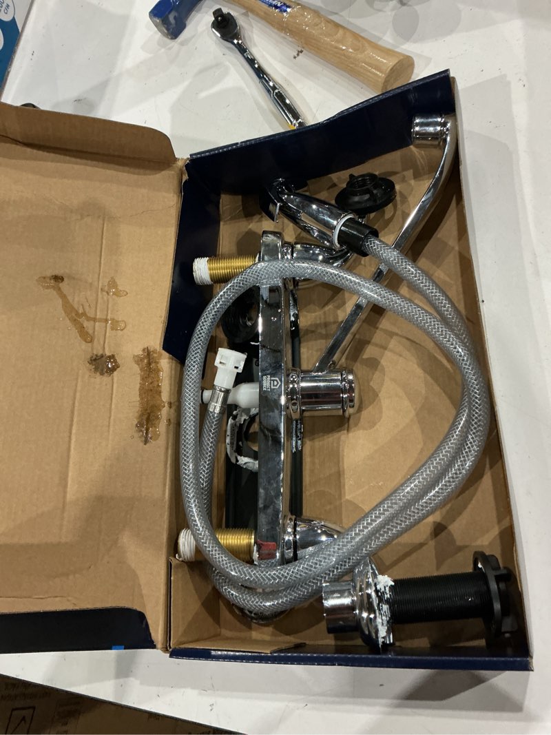 Condition photo showing As Is for project source dover chrome double handle deck-mount kitchen faucet (includes deck plate) (includes side sprayer)
