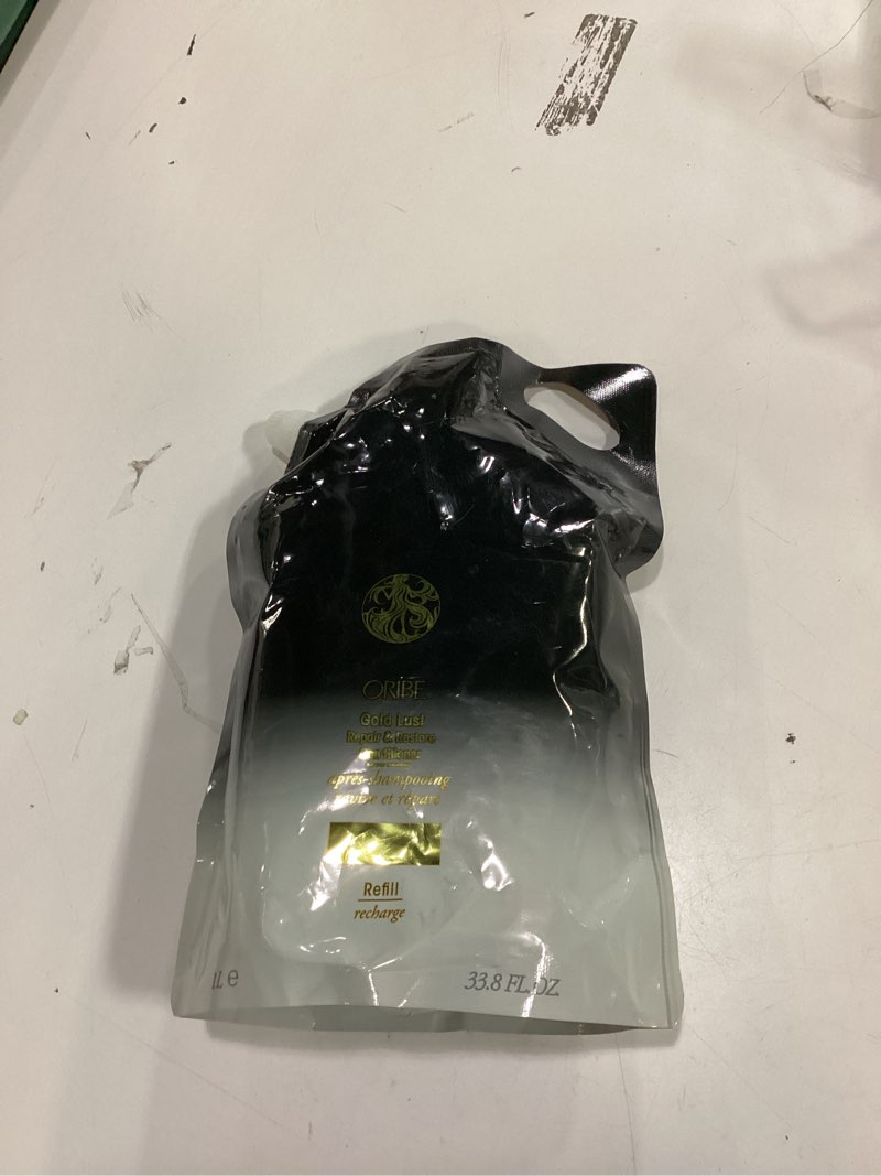 Condition photo showing New/Like New for ORIBE Gold Lust Conditioner Refill Pouch
