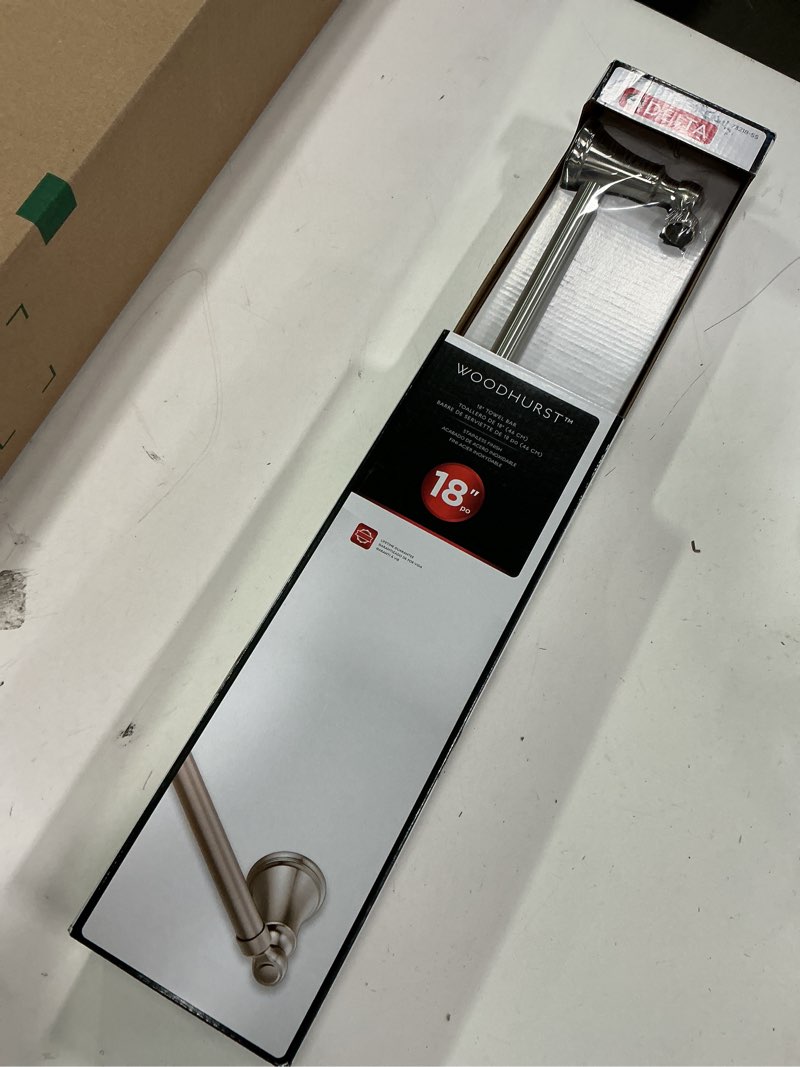 Condition photo showing New/Like New for DELTA FAUCET Rubber Limited 73218-SS Woodhurst 18 in. Wall Mount Towel Bar Bath Hardware Accessory i