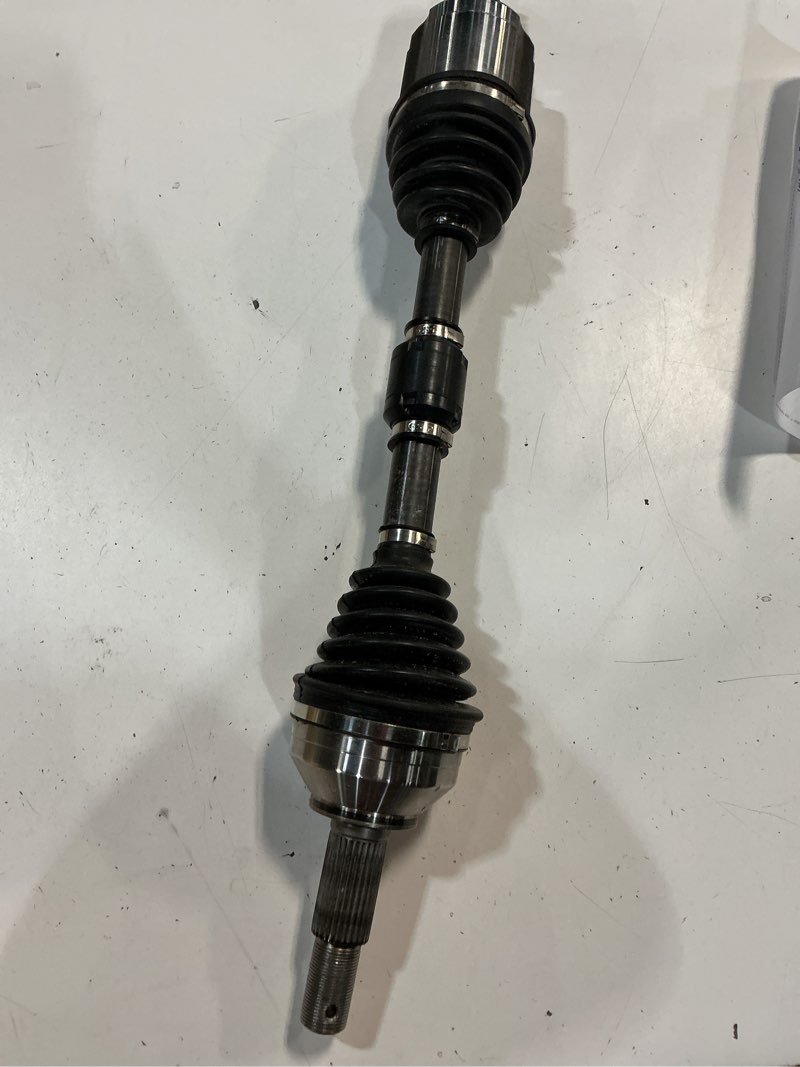 Condition photo showing As Is for gsp ncv53911 cv axle shaft assembly - left front (driver side), black & silver