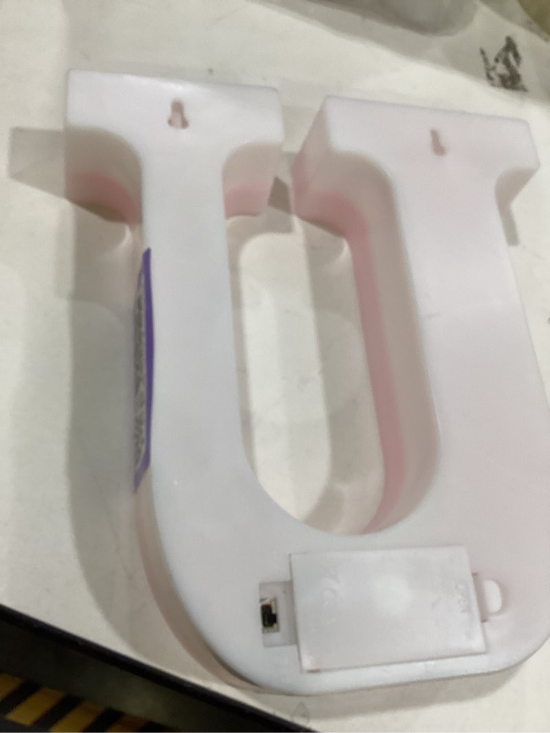 Condition photo showing Good Condition for  a pink glitter LED marquee letter light, specifically the letter 'U'