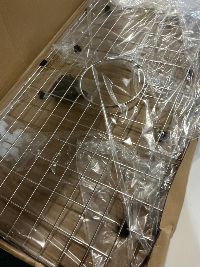 Condition photo showing Good Condition for serene valley sink protector grid 26-1/16" x 14-1/16", centered drain with corner radius 3-1/2", 304 stainless steel material nlw2614c