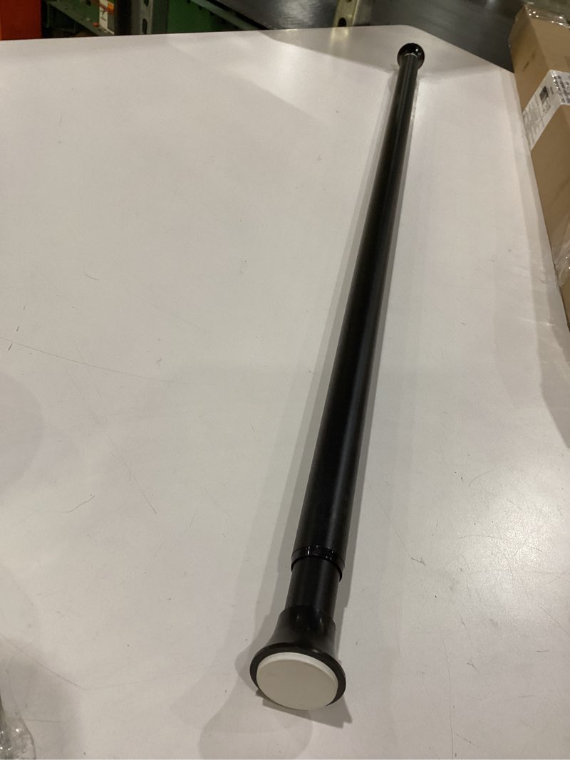 Condition photo showing Good Condition for Amazon Basics Adjustable Sturdy Spring Tension Curtain Rod, No Drilling/No Holes, 36-54", Black, Classic Finial Black 36-54" Indoor