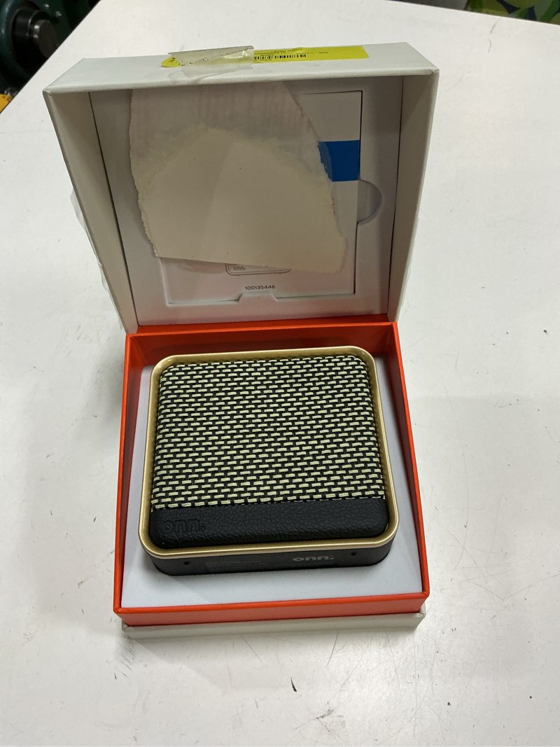Condition photo showing As Is for onn small black multi-room wi-fi speaker with bluetooth technology, ip67 waterproof