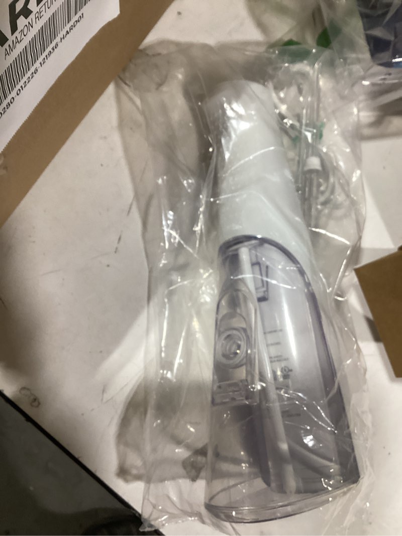 Condition photo showing Good Condition for Waterpik Cordless Pulse Rechargeable Portable Water Flosser for Teeth, Gums, Braces Care and Travel with 2 Flossing Tips, Waterproof for Shower, ADA Accepted, WF-20 White, Packaging and Tips May Vary
