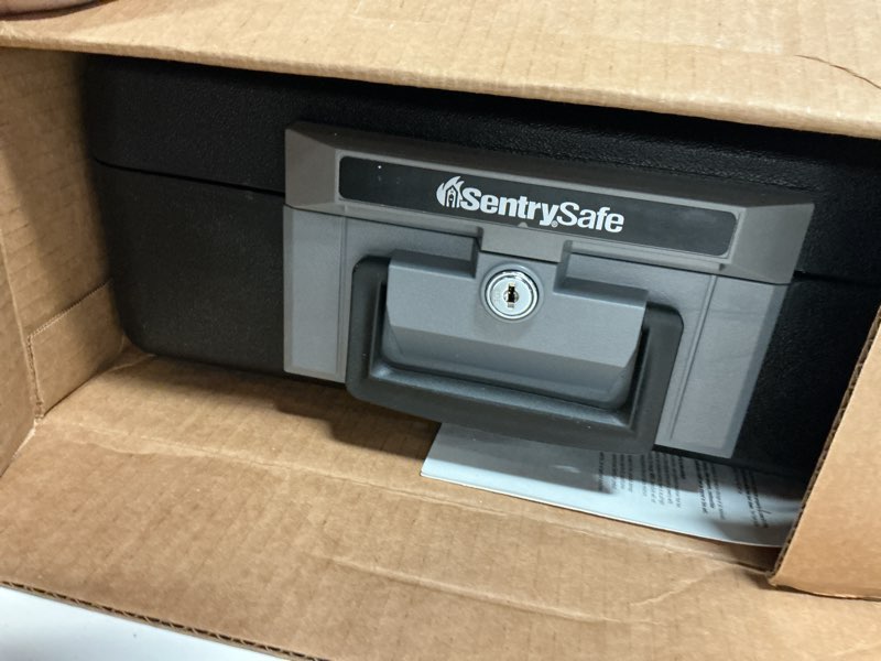 Condition photo showing Good Condition for sentrysafe fireproof safe box with key lock, chest safe with carrying handle to secure money, jewelry, documents, 0.25 cubic feet, 6.3 x 15.3 x 12.1 inches, 1160
