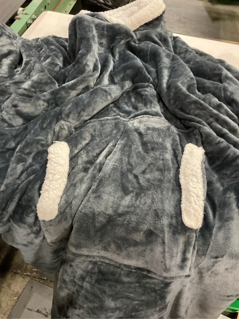 Condition photo showing As Is for oversized wearable blanket with sleeves, hood and pocket for gifts, dark gray