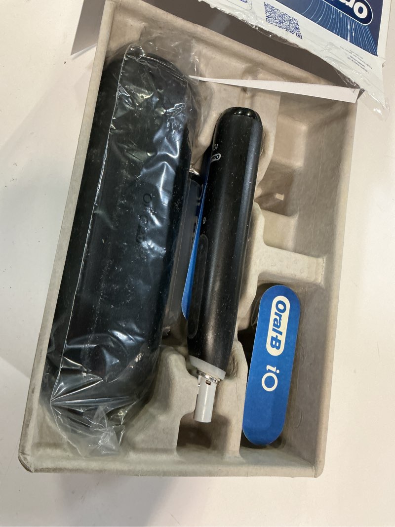 Condition photo showing As Is for Oral-B iO Deep Clean + Whiten Rechargeable Electric Toothbrush with Visible Pressure Sensor, 2 Minute Timer, 5 Cleaning Settings, 1 iO5 Limited, 3 Toothbrush Heads, Travel Case & Refill Holder, Black Black 1 Count (Pack of 1)