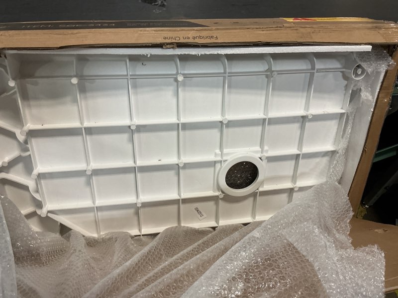 Condition photo showing As Is for WOODBRIDGE 34 In. X 34 In. Solid Surface Neo-Angle Shower Base Pan In White With Drain Cover SQE-3434-BG