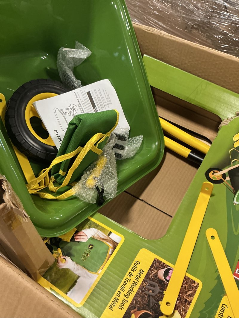 Condition photo showing As Is for John Deere Deluxe 34" Wheelbarrow and Garden Set Includes 5 Realistic Gardening Tools,Gardening Apron, Gardening Gloves, Large Metal Wheelbarrow with Wooden Handles, Outdoor Toy Ages 5+