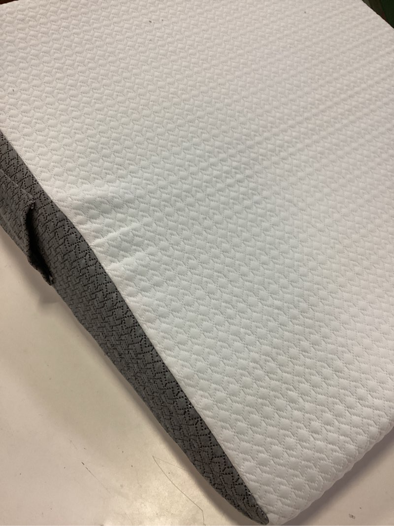 Condition photo showing As Is for nordjager leg pillow for elevation & support, 24"x22"x8" memory foam cushion with grey white patterned polyester cover, ideal for improving circulation & relaxing leg