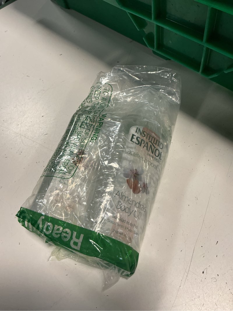 Condition photo showing As Is for instituto español almond body oil. moisturizes, nourishes and keeps your skin young. gentle formula. enriched with vitamins. 8.5 fl.oz