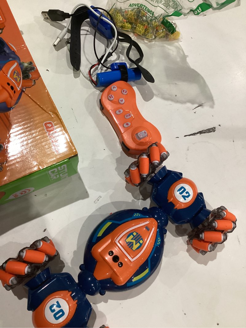 Condition photo showing As Is for Gesture Sensing RC Stunt Car - Boys Girls Toys Age 6-8-12, 4WD Hand Controlled Remote Control Twist Car with Light & Music,Cool Birthday presents and Ideas Gifts for Kids Age 6 7 8 9 10 11 12 YearsOld Blue Orange