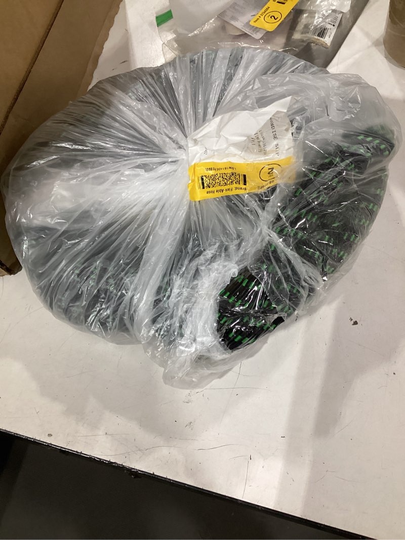 Condition photo showing Good Condition for black and green cloth garden hose