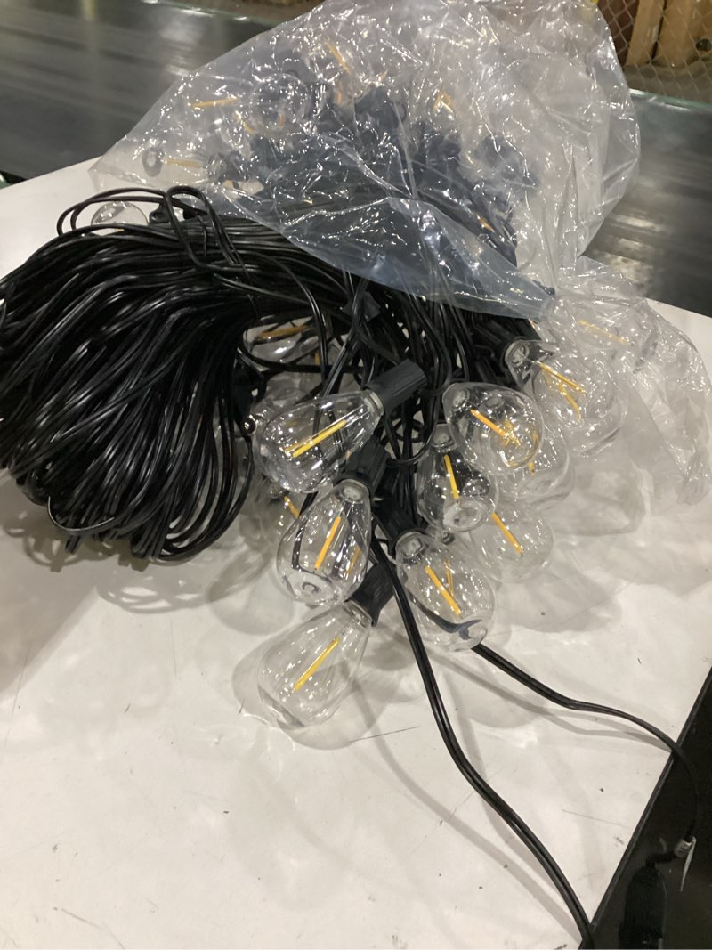 Condition photo showing As Is for similar to item 200ft outdoor string lights with remote, waterproof patio lights with 72+2 shatterproof led bulbs, low voltage adapter for backyard garden porch bistro decor, timer & dimmer modes warm white-2700k 200ft