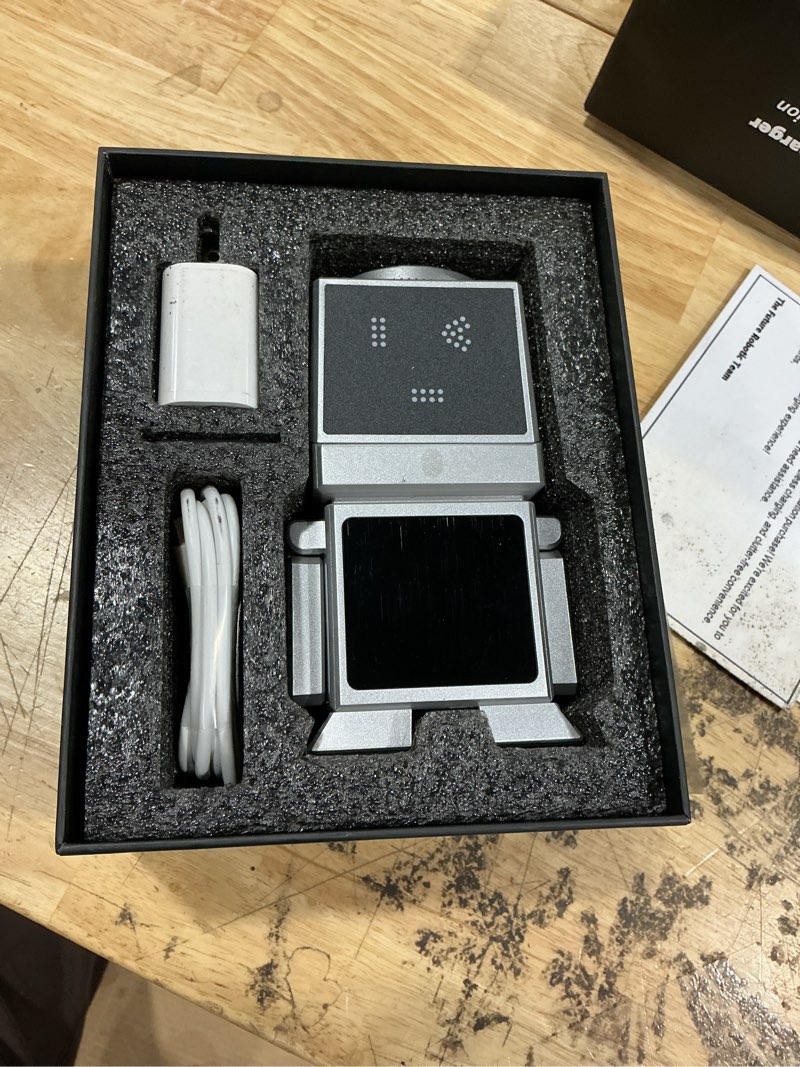 Condition photo showing As Is for robot 7-in-1 wireless charging station, qi2 25w magnetic rotating charger dock for iphone iwatch airpods, bluetooth speaker, alarm clock with lcd display, nightstand organizer for desk bedroom, sliver