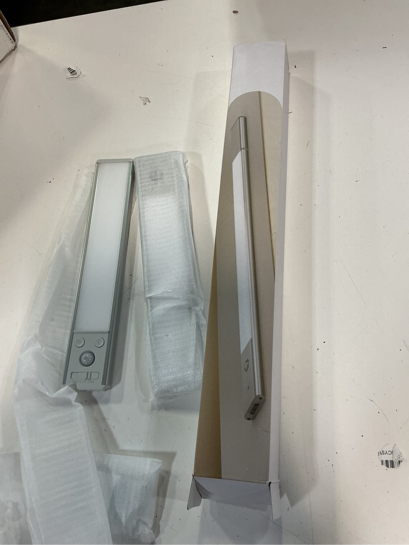 Condition photo showing New/Like New for ezvalo under cabinet lighting, 2200mah closet lights with 2 extra batteries, 3 color temps motion sensor lights indoor, led lights for closet, pantry, kitchen silver 2pcs + 2 batteries