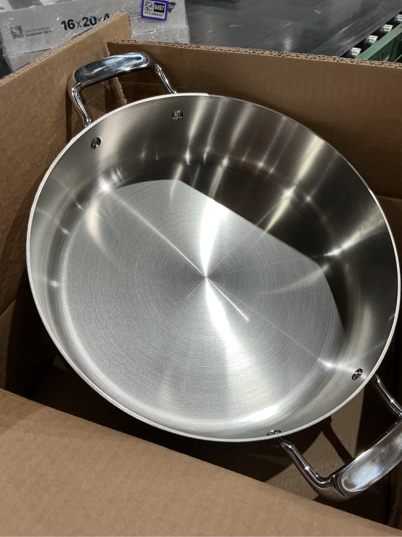 Condition photo showing New/Like New for tramontina 6 qt covered braiser - tri-ply clad ss - sea - gourmet