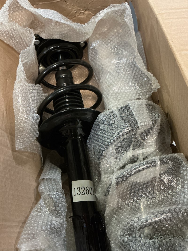 Condition photo showing As Is for auto front left-right quick complete strut - coil spring