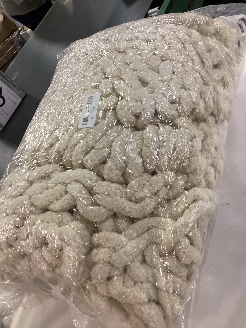 Condition photo showing As Is for YAAPSU Chunky Knit Throw Blanket for Couch, 51"x63", 100% Hand Knitted Thick Cable Knit with Cozy Jumbo Chenille Yarn, Soft Large Rope Knot Crochet Blankets for Sofa Bed Living Room Décor, Beige Beige 51x63 inch