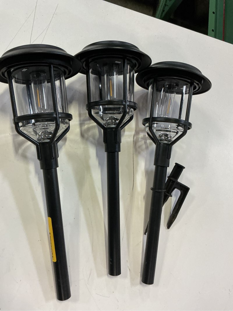 Condition photo showing As Is for harbor breeze 15 -lumens black solar led outdoor path light with dusk-to-dawn sensor 3000-k  3 pack