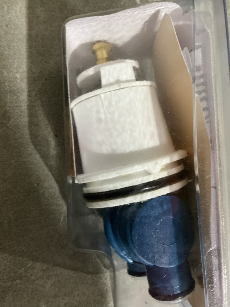 Condition photo showing As Is for danco hot and cold faucet cartridge for delta