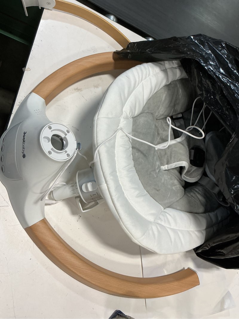 Condition photo showing As Is for Jool Baby Nova Nature Baby Swing for Newborns with Natural Wood Toys, Electric Motorized Infant Swing, Bluetooth Music, Remote (Oatmeal)