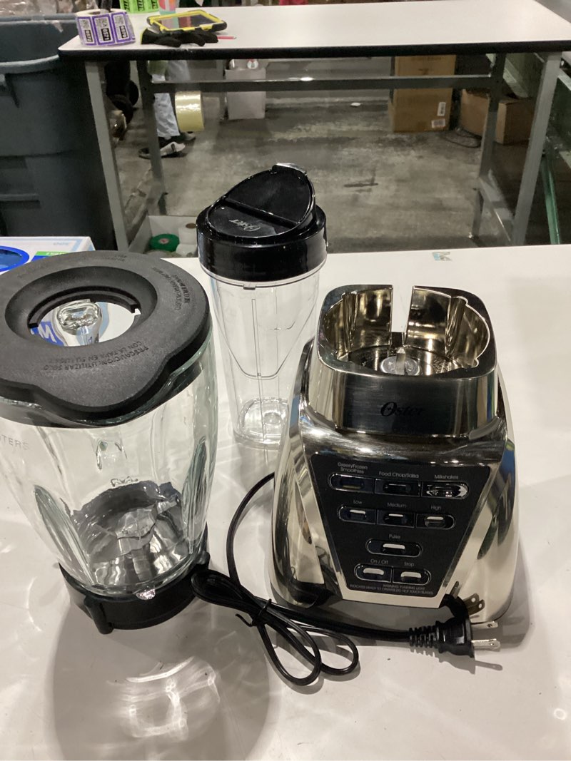 Condition photo showing As Is for NOT TESTED\nOster Pro 1200 Smoothie Blender with Glass Jar & 24oz To-Go Cup, Countertop Kitchen Blender with 7 Speeds, 1200W Power, Brushed Nickel MISSING CAP
