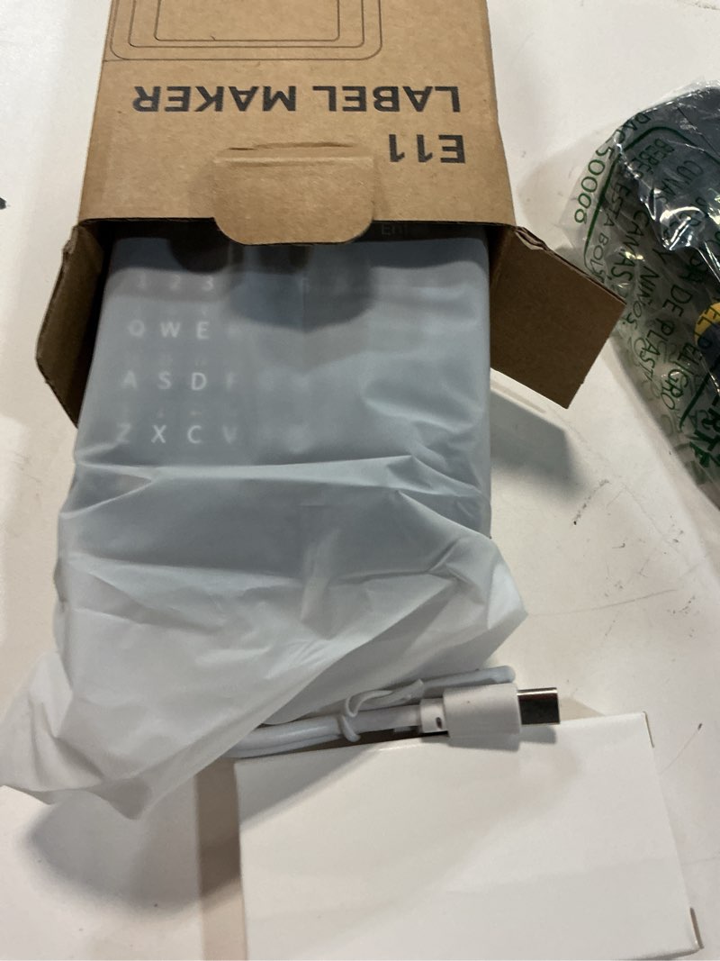 Condition photo showing New/Like New for supvan e11 bluetooth label maker machine with 4 tapes, support keyboard & app with 40 fonts and 650+ icons, rechargeable inkless labeler for home, kitchen, office, school, organization, black machine + 4 tapes