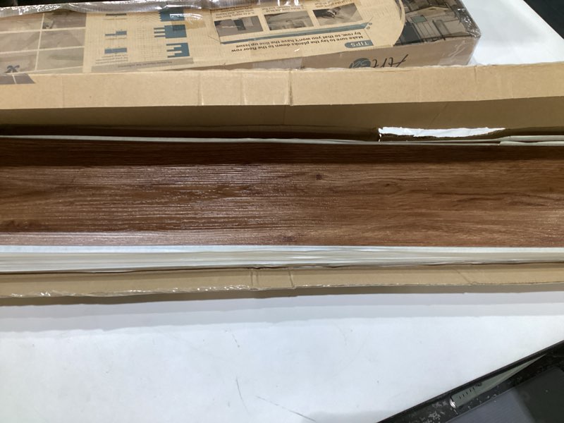 Condition photo showing Good Condition for Art3d 36-Pack 54 Sq.ft Peel and Stick Floor Tiles Vinyl Plank Flooring Wood Look, Adhesive and Waterproof Tile Sticker for Bedroom, Living Room, Kitchen, RV in Rosewood 36 x 6 x 0.1 inches Rosewood 36
