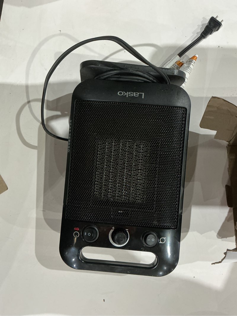 Condition photo showing As Is for lasko - 1500-watt oscillating personal tabletop ceramic space heater with adjustable thermostat - black