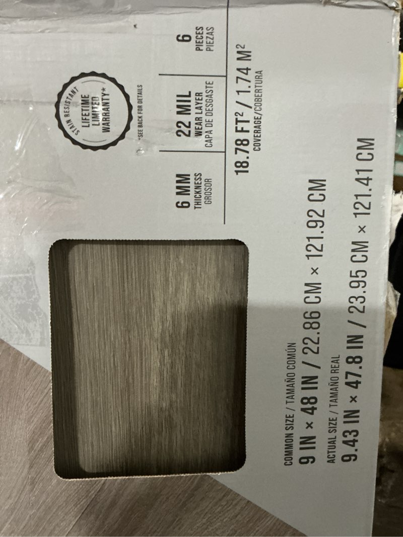 Condition photo showing As Is for stainmaster northport oak gray wood look 22-mil x 9-in w x 47-in l waterproof and water resistant interlocking luxury vinyl plank flooring ( 18.78-sq ft carton )