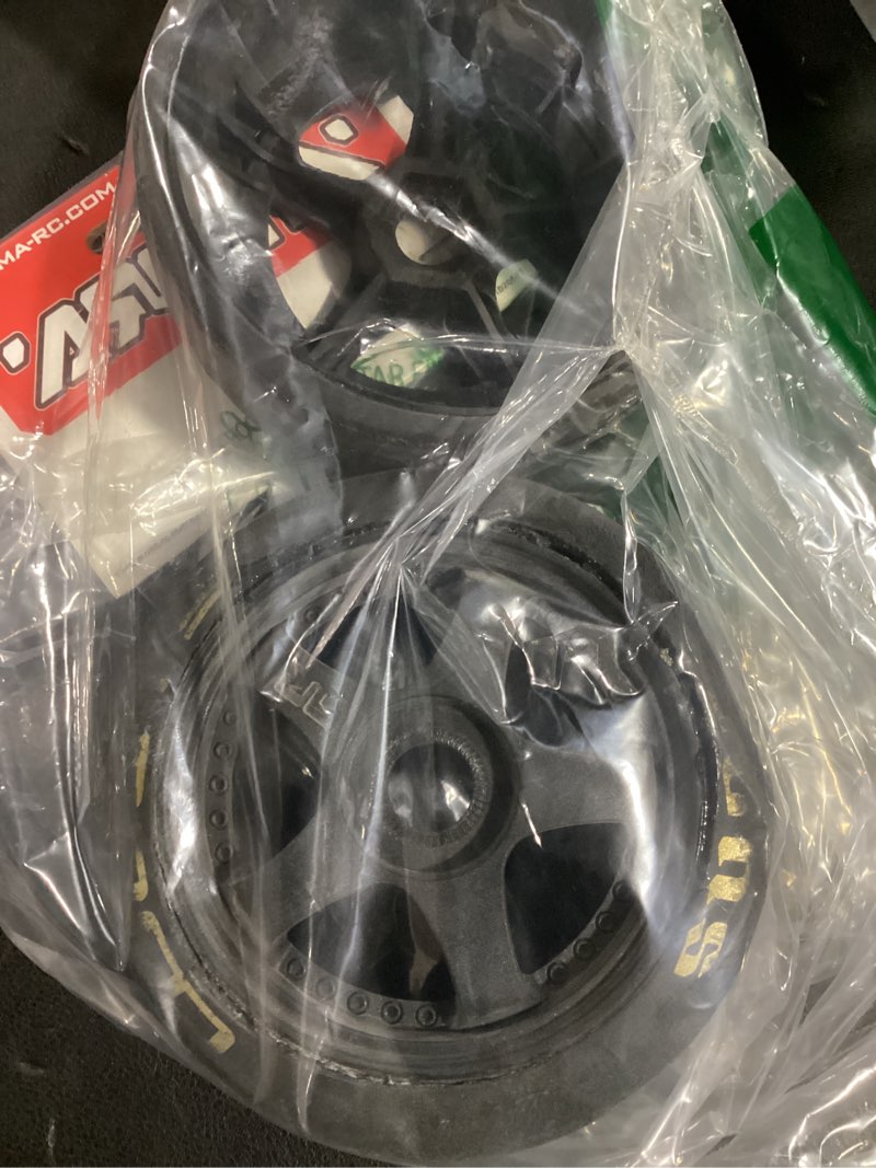 Condition photo showing As Is for arrma dboots hoons 42/100 2.9 belted rc tires with foam inserts, mounted on 5-spoke black wheels (set of 2): ara55062 hoons 2.9 tires on 5-spoke wheel white compound: all purpose