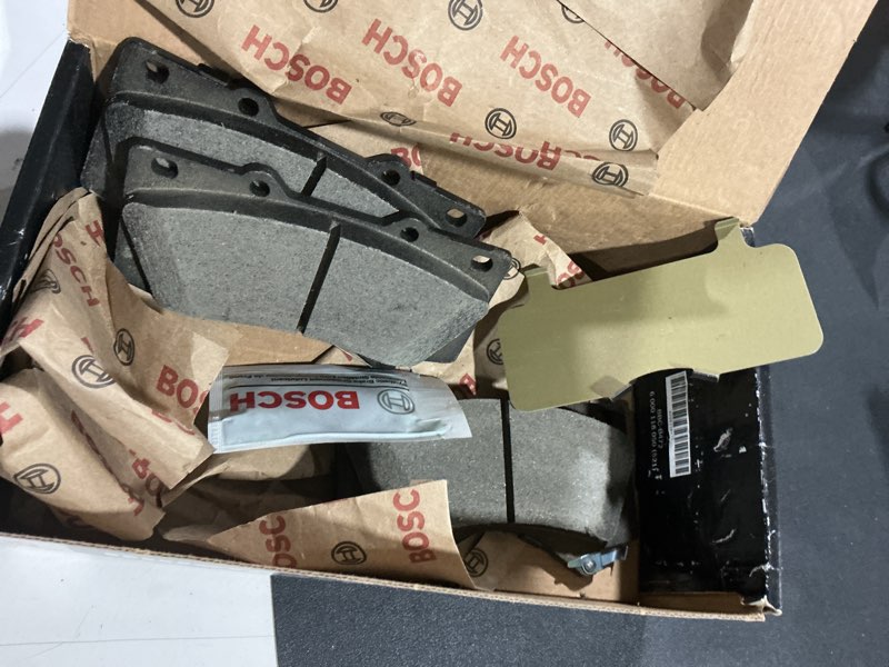 Condition photo showing As Is for BOSCH BC1303 QuietCast Premium Ceramic Disc Brake Pad Set - Compatible with Select Lexus LX570; Toyota Land Cruiser, Sequoia, Tundra; FRONT