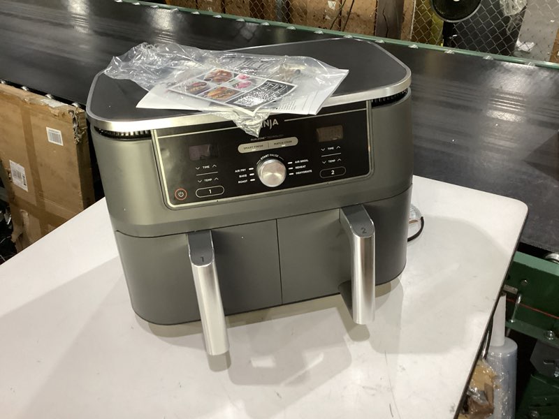 Condition photo showing As Is for ninja dz401 foodi 10 quart 6-in-1 dualzone xl 2-basket air fryer with 2 independent frying baskets, match cook & smart finish to roast, broil, dehydrate for quick, easy family-sized meals, grey 10qt grey