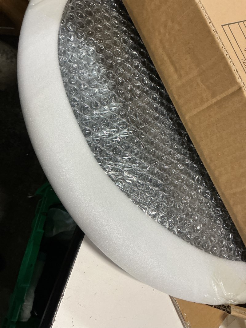 Condition photo showing As Is for round metal outdoor side table with zinc-coated tabletop and adjustable feet in black