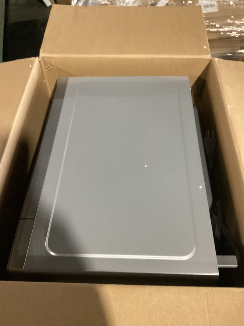 Condition photo showing New/Like New for sharp countertop microwave oven with removable 10.6" carousel turntable, 900 watt, 0.9 cubic feet, stainless steel