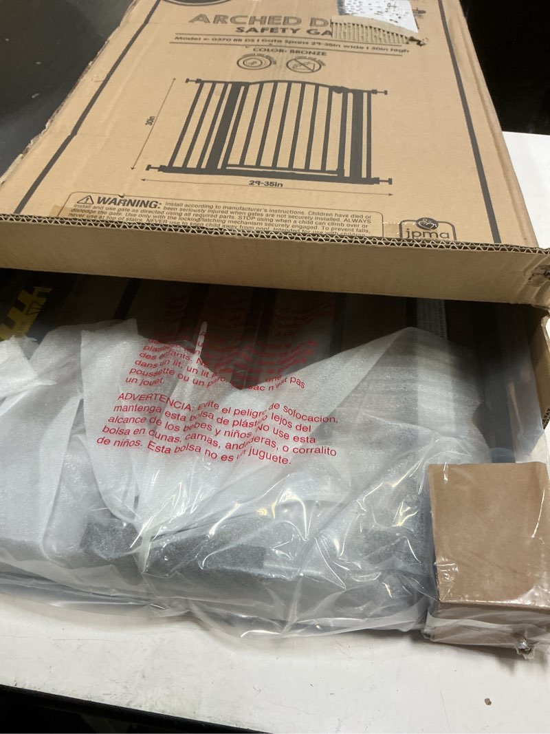 Condition photo showing Good Condition for regalo 35-inch home accents super wide walk through baby gate, includes 4-inch, 8-inch and 12-inch extension, 4 pack of pressure mounts and 4 pack of wall cups and mounting kit bronze - 29-35"w x 30"h