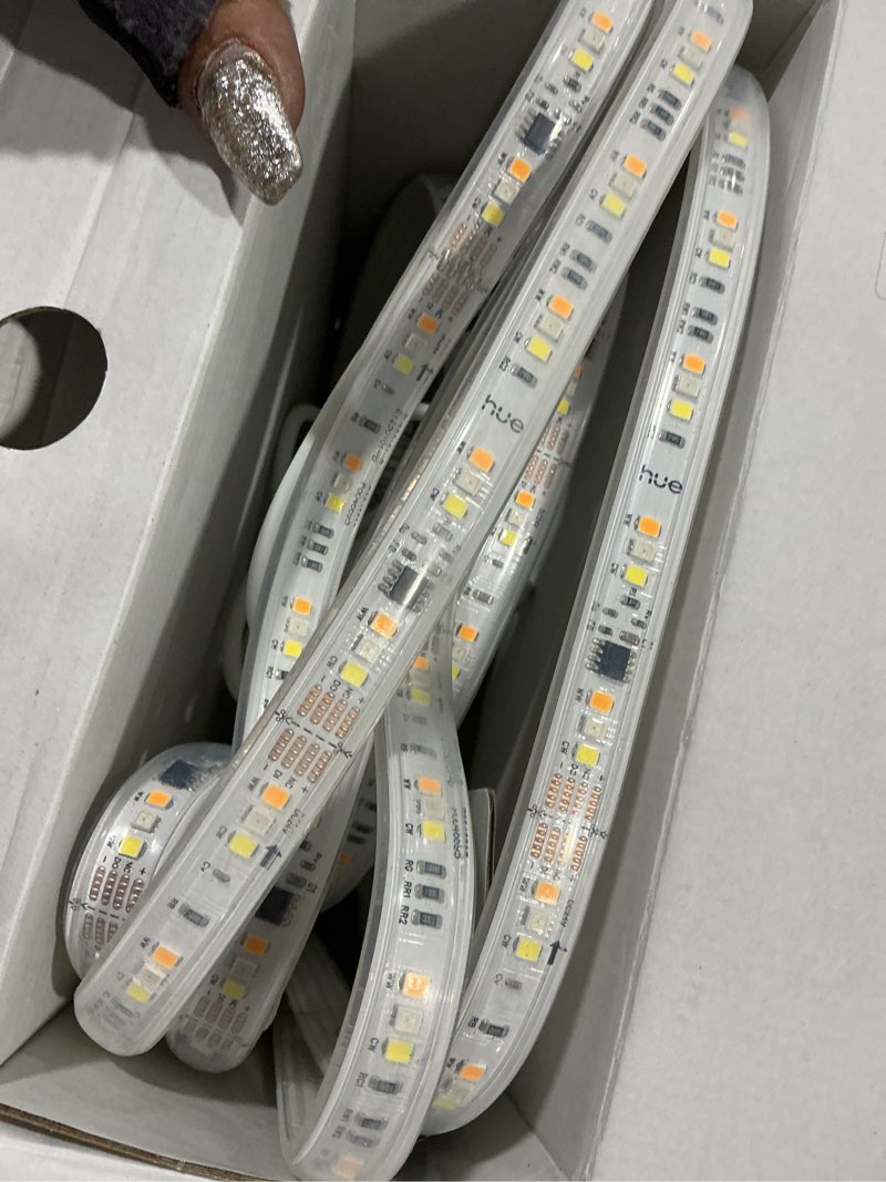 Condition photo showing As Is for hue flux 16-feet led strip light, 3000 lm, vibrant color and ambiance, flexible indoor lighting, chromasync™ color blending, rgbwwic, cuttable, extendable, reusable, app and voice control flux lightstrip 16-feet