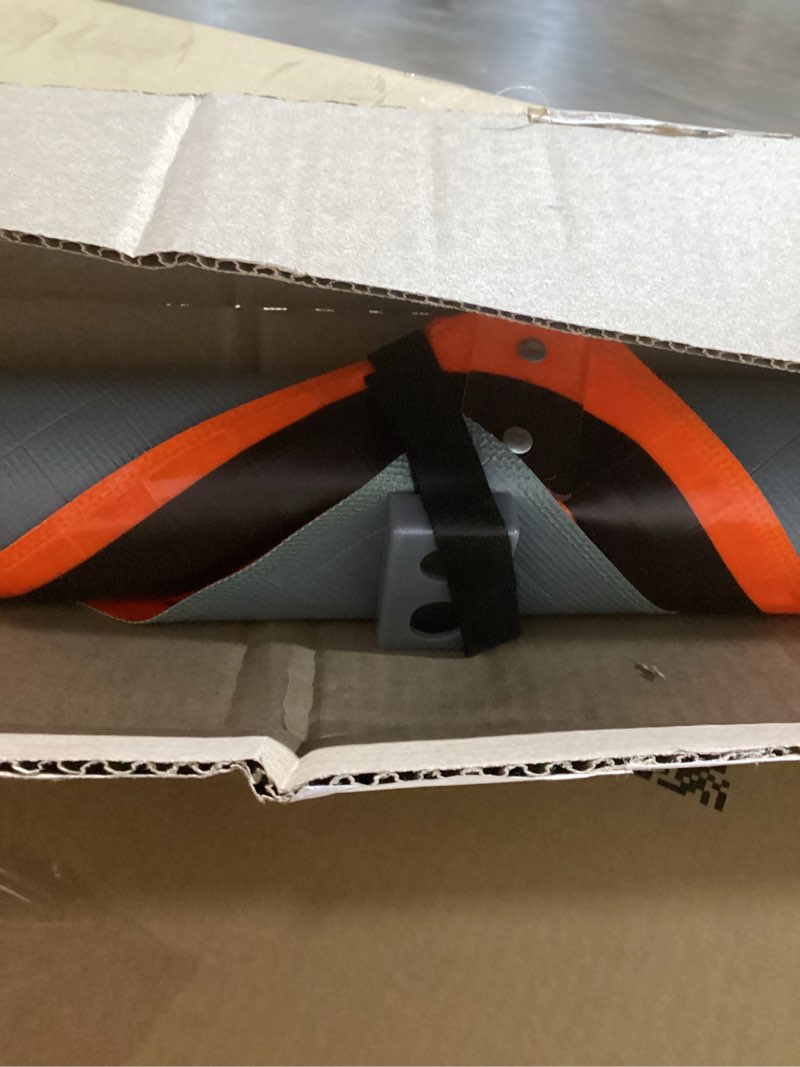 Condition photo showing New/Like New for 48" Reflective Fluorescent Orange Roll-Up Warning Sign. (TRUCKS ENTERING AND LEAVING HIGHWAY)