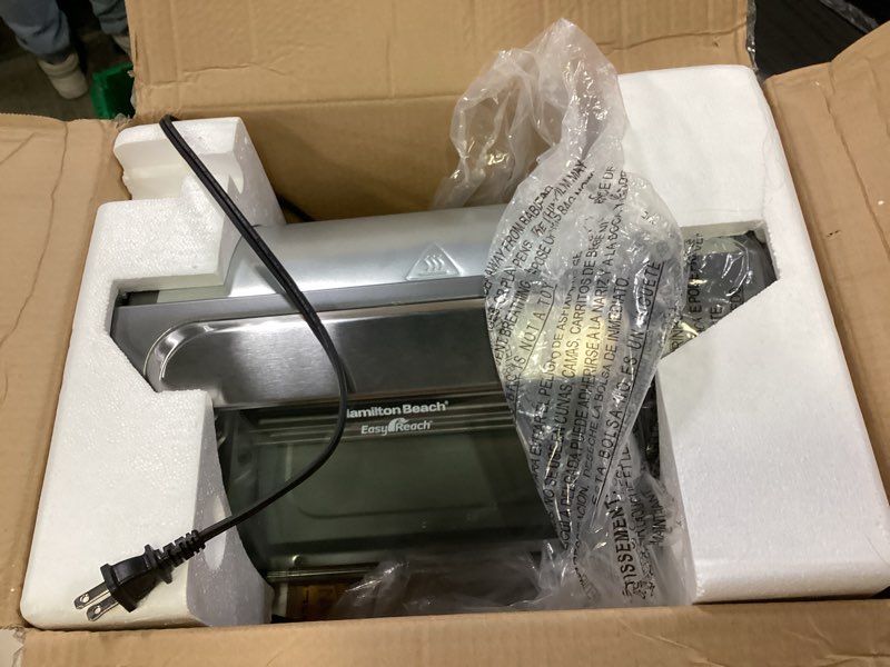 Condition photo showing New/Like New for Hamilton Beach Easy Reach 4-Slice Countertop Toaster Oven With Roll-Top Door, 1200 Watts, Fits 9” Pizza, 3 Cooking Functions for Bake, Broil and Toast, Silver (31344DA) Silver 4-Slice