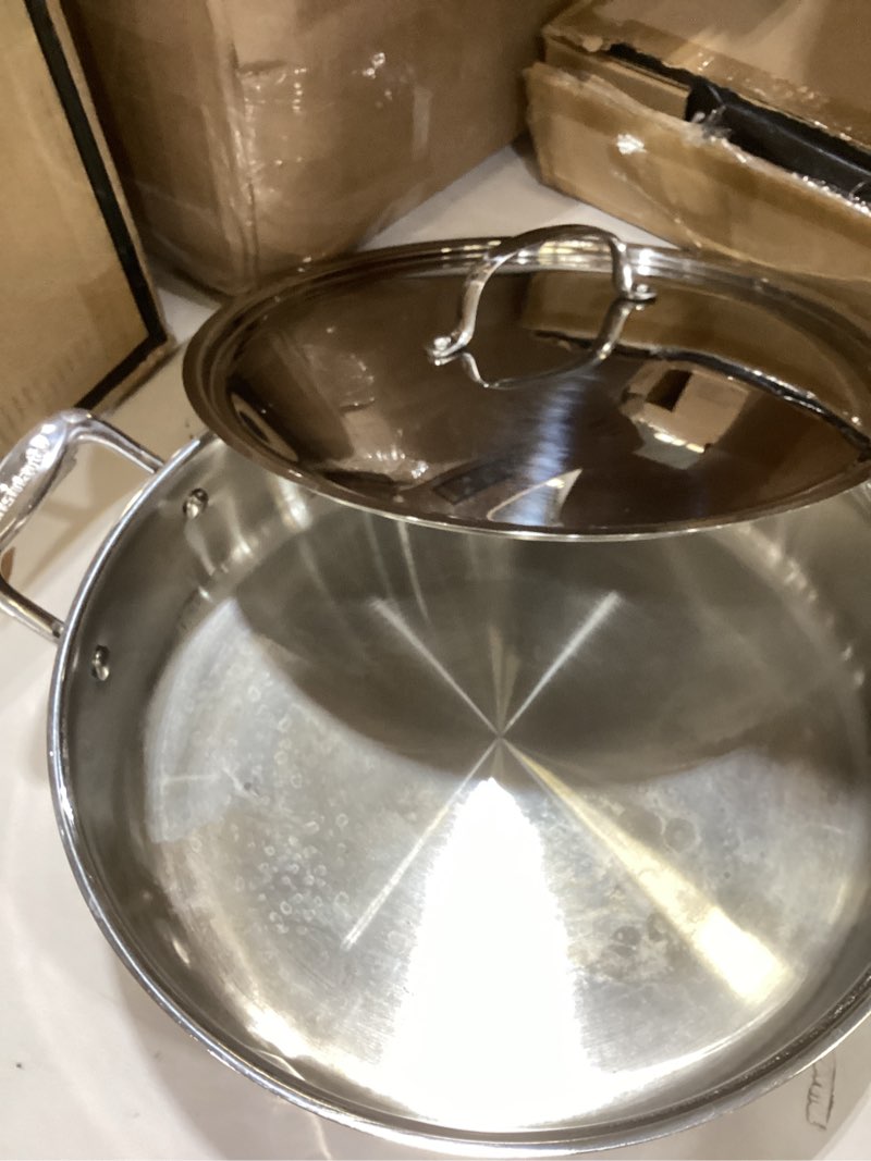Condition photo showing As Is for cuisinart stainless steel, 5.5 quart sauté pan w/ cover, helper handle, chef's classic, 733-30h