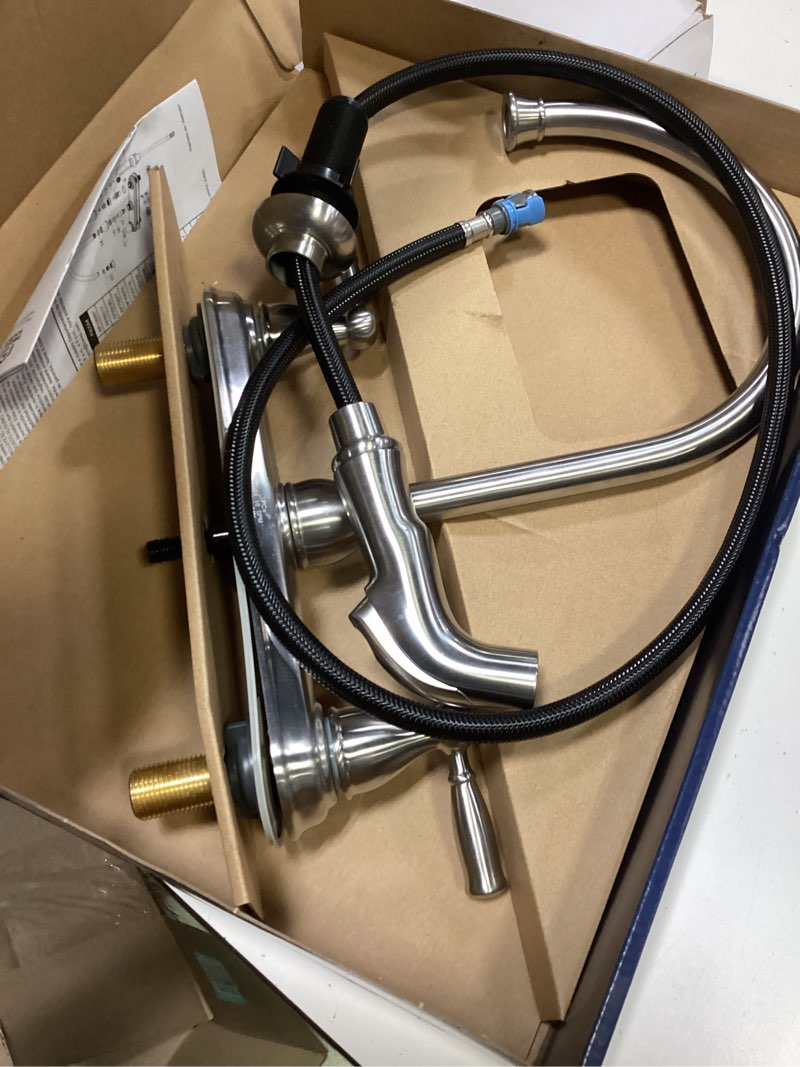 Condition photo showing As Is for project source brice stainless steel double handle kitchen faucet (deck plate and side spray included)