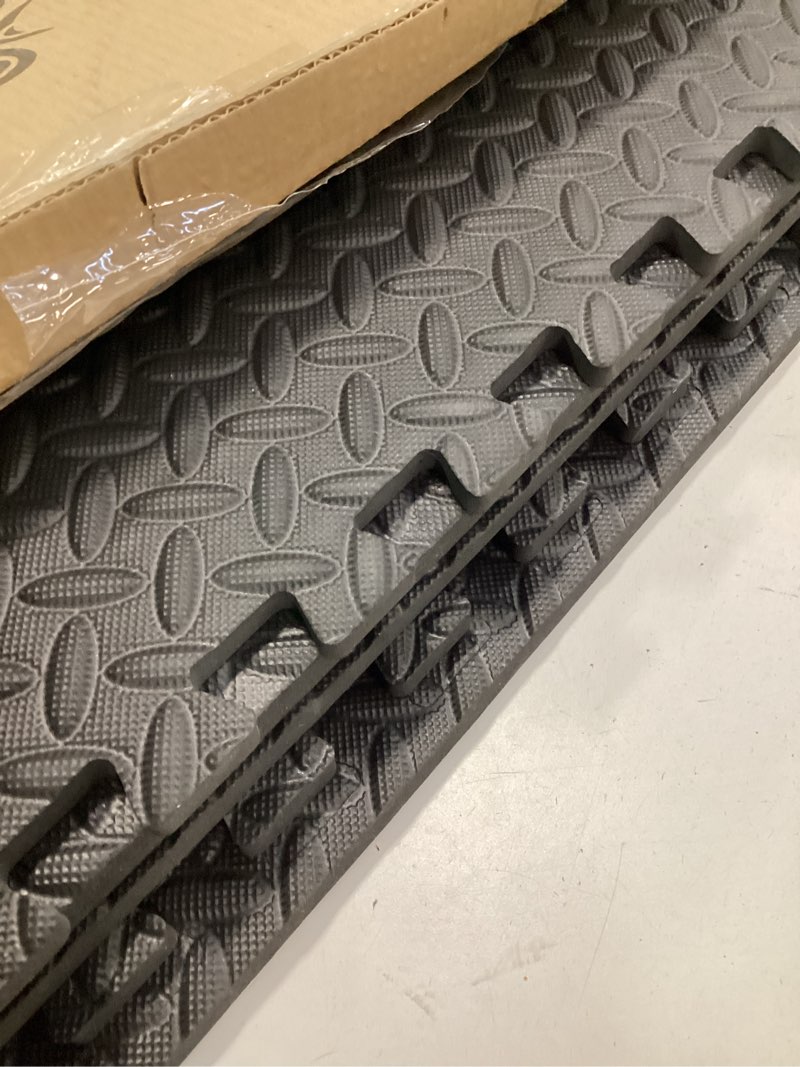 Condition photo showing As Is for ( incomplete) ProsourceFit Puzzle Exercise Mat ½ in, EVA Interlocking Foam Floor Tiles for Home Gym, Mat for Home Workout Equipment, Floor Padding for Kids, Black, 24 in x 24 in x ½ in, 24 Sq Ft - 6 Tiles Black - 1/2 Inch - 24 Sq Ft - 6 Tiles
