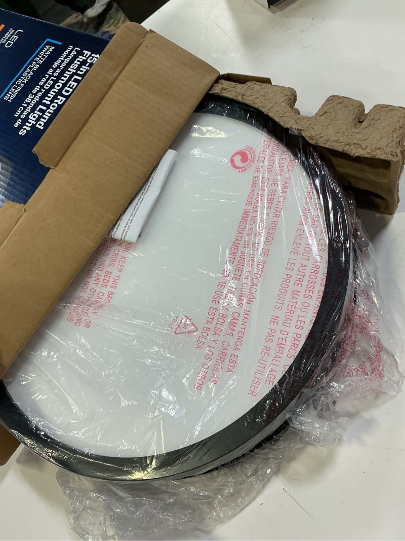 Condition photo showing As Is for project source edge light 1 -light 15-in matte black indoor/outdoor integrated led flush mount light 2 -pack